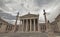 Athens Greece, the national academy classical building facade with Athena and Apollo statues standing on Ionian style columns.