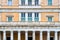 Athens, Greece Parliament building architectural detail. Marble columns and windows with green shutters