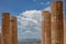 Athens, Greece. Propylaea columns in the Acropolis, blue cloudy sky in spring sunny day