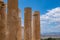 Athens, Greece. Propylaea columns in the Acropolis, blue cloudy sky in spring sunny day