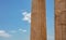 Athens, Greece. Propylaea columns in the Acropolis, blue cloudy sky in spring sunny day