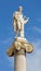 Athens - The statue of Apollo on the column in front of The National Academy building by Leonidas Drosis
