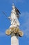 Athens - The statue of Athena on the column in front of The National Academy building by Leonidas Drosis