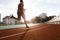 Athlete african man running on racetrack