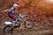 Athlete bike enduro in forest trail downhill competition motocross