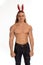 Athlete bodybuilder shirtless with long hair posing with a rabbit-like ears