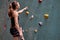 Athlete Caucasian Sportswoman Climber Is Going To Climb Artificial Rock Wall