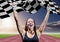 Athlete celebrating her victory with checkered flag on race track