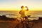 Athlete cyclist man drinking water on bike