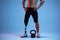 Athlete with disabilities or amputee  on blue studio background. Professional male sportsman with leg prosthesis