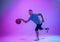 Athlete with disabilities or amputee isolated on gradient studio background. Professional male basketball player with