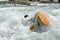 Athlete does stunts with canoe on the river