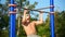 Athlete doing pull-up on horizontal bar