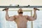 Athlete doing pull-ups