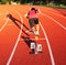 Athlete exploding out of starting blocks