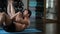 Athlete and fat guy train their abdominal muscles in the gym