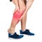 Athlete feeling calf pain from exercise isolated over white background. Sportsman suffering muscle cramp