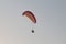 Athlete flying parachute by the sea