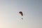 Athlete flying parachute by the sea