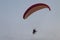 Athlete flying parachute by the sea