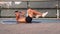 athlete guy doing bicycle exercise for abs muscles outdoor, keep fit