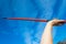 Athlete Hand Red Javelin Blue Sky