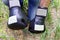 Athlete with hands in leather boxing gloves rests on the ground