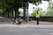 Athlete with its special bike on a city track during a race near security and traffic control officer with a yellow reflective