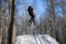 Athlete jumping dirt jumping on bmx in winter