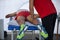 Athlete lying on a Bed while having Legs Massaged after a Physical Sports Workout