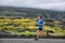 Athlete male runner running on mountain road