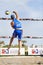 Athlete man beach volleyball jumping spike attack