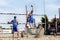 Athlete man beach volleyball jumping spike attack. Defense.