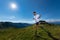 Athlete man practicing mountain running in the sun at high altitude