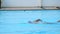 Athlete man swimming breaststroke in the swimming pool.