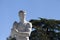 Athlete Marble statue portrait against blue sky