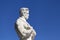 Athlete Marble statue portrait against blue sky