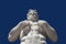 Athlete Marble statue portrait against blue sky