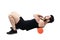 Athlete massaging upper back muscles with foam roller