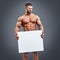 Athlete with muscles holding blank white poster