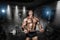 Athlete muscular bodybuilder in the gym training with bar