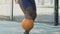 Athlete playing basketball, dribbling ball skillfully to bypass opponent, sports