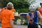 Athlete receives energy drink at a triathlon event