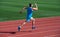 athlete runner do aerobic or anaerobic load. man start running on stadium. fitness gym outdoor. muscular athletic runner
