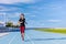 Athlete runner running on outdoor stadium tracks