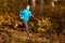 Athlete running in the forest in autumn