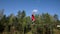 Athlete In Skydiving Suit Performs Stunt Above Vertical Wind Tunnel.