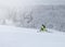 Athlete on a snowmobile moving in the forest