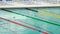 Athlete swimming crawl stroke in pool, training before competition, water sports