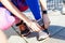 Athlete ties his shoelaces before a run